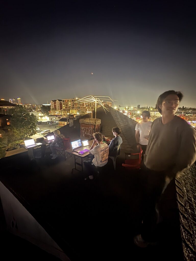 Delta Rho brothers on the chapter house roof deck